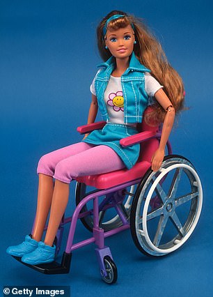 The 1997 'Share a Smile Becky,' a brunette doll in a denim skirt-vest combo sits in a wheelchair